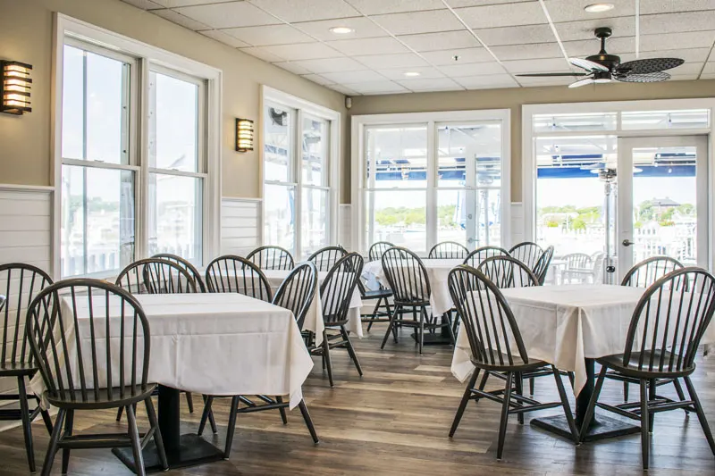 Bright dining room with harbor-view windows