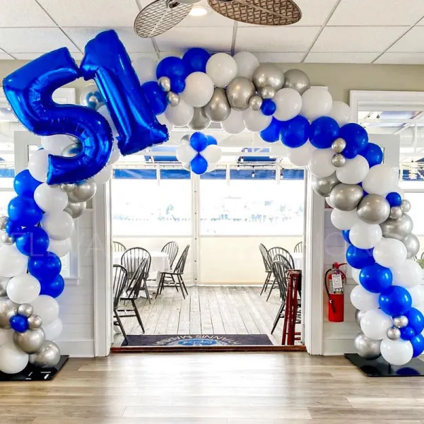 Blue and silver balloon arch in the dining room